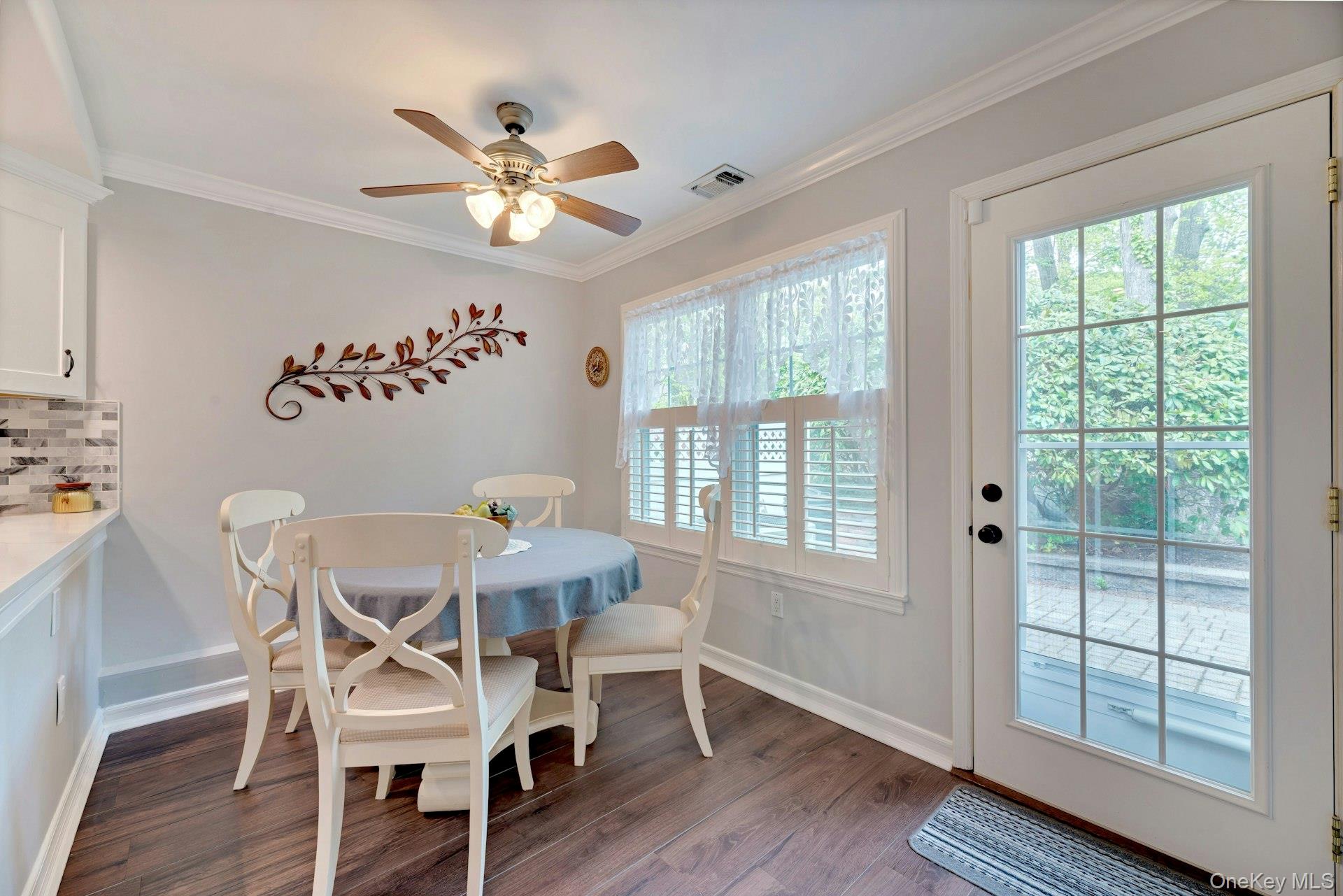 104 Glen Drive Ridge, NY 11961 - Photo 13 of 25 a view of a dining room with furniture window and wooden floor