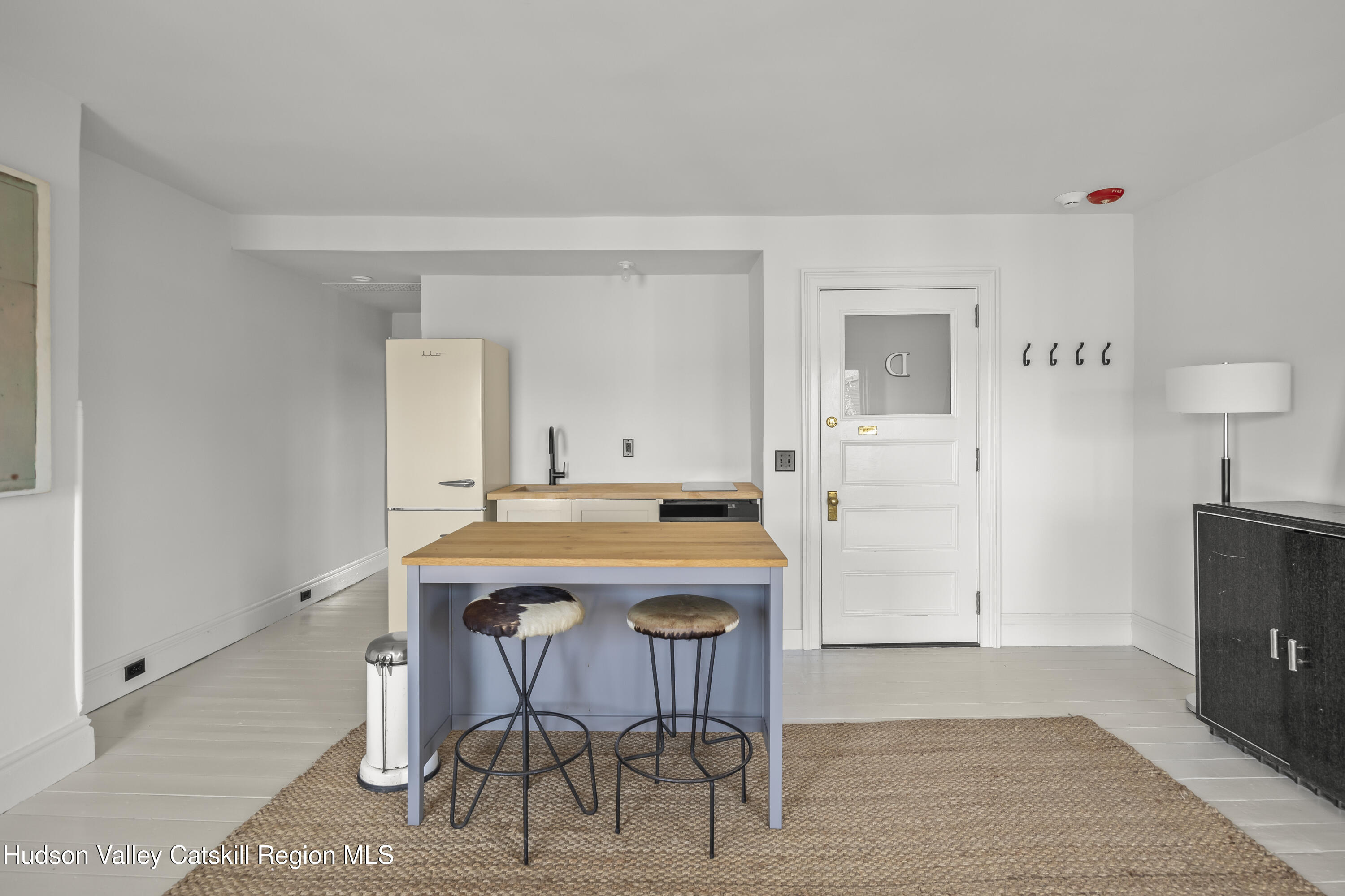 620 Warren Street, Unit D Hudson, NY 12534 - Photo 5 of 8 a view of a dining room with furniture