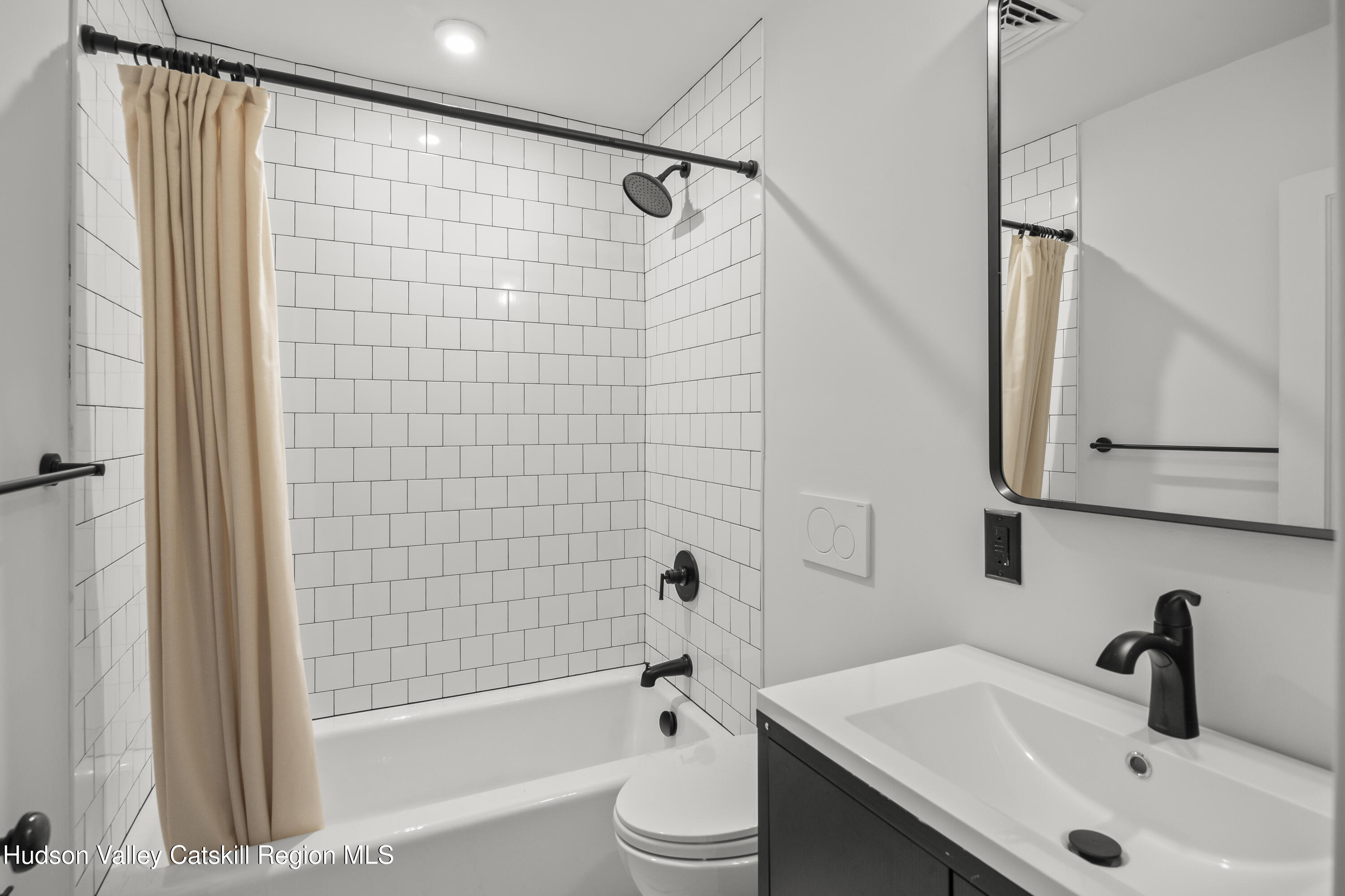 620 Warren Street, Unit D Hudson, NY 12534 - Photo 8 of 8 a bathroom with a sink a toilet and shower