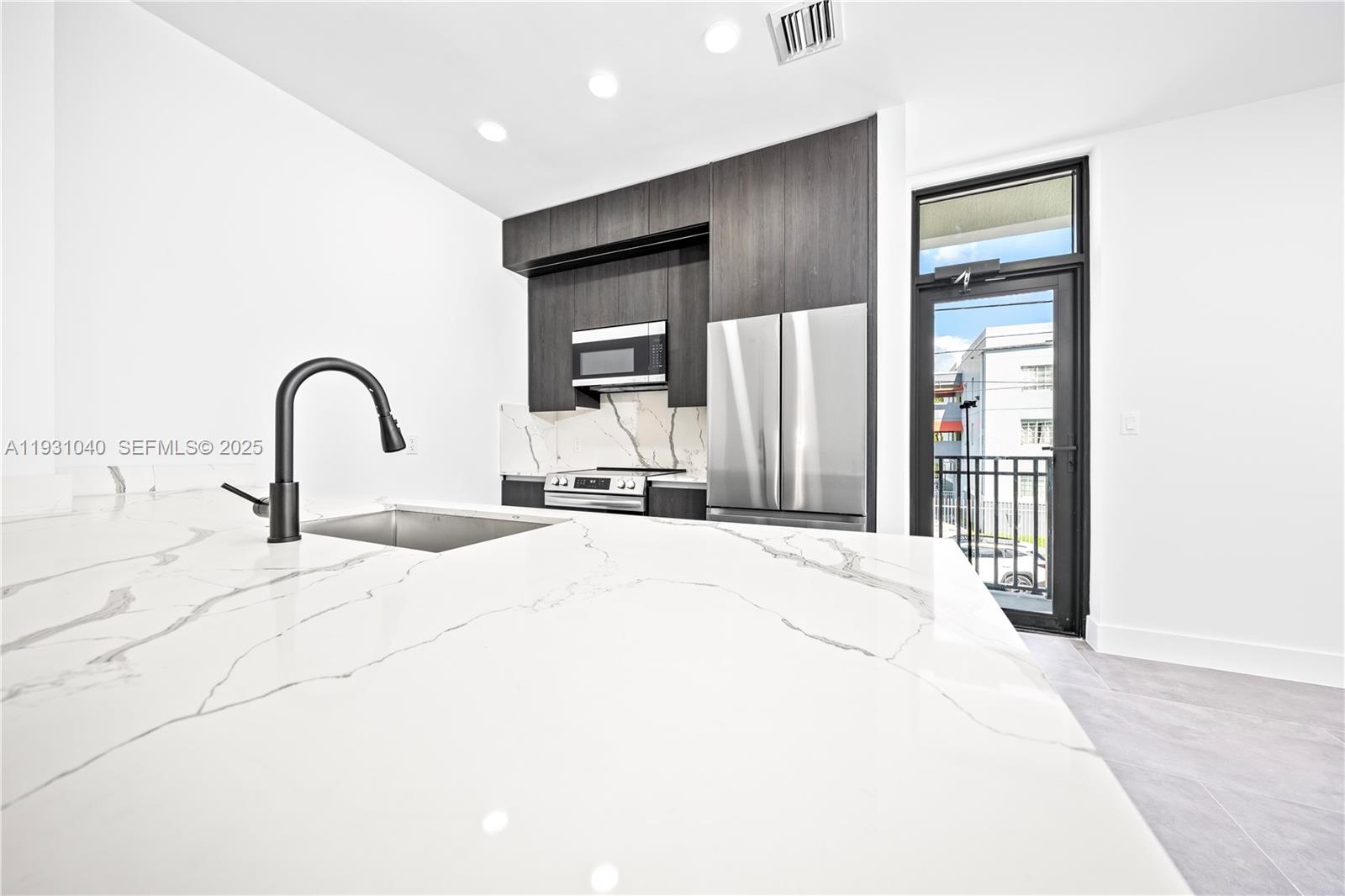 526 Southwest 2nd Street, Unit 1 Miami, FL 33130 - Photo 25 of 30 a bedroom with a bed and a dresser