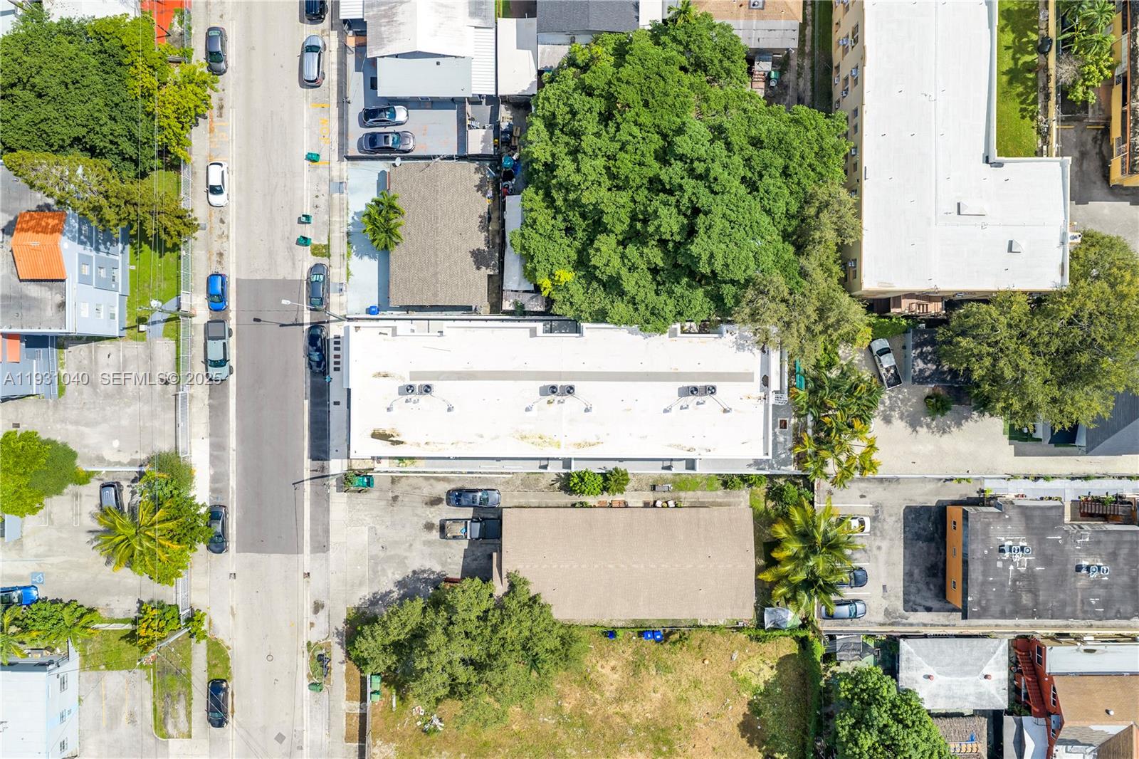 526 Southwest 2nd Street, Unit 1 Miami, FL 33130 - Photo 28 of 30 an aerial view of residential houses with outdoor space and trees all around