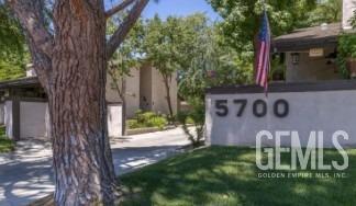 Undisclosed Address Bakersfield, CA 93309 - Photo 2 of 3 a front view of a house with a yard