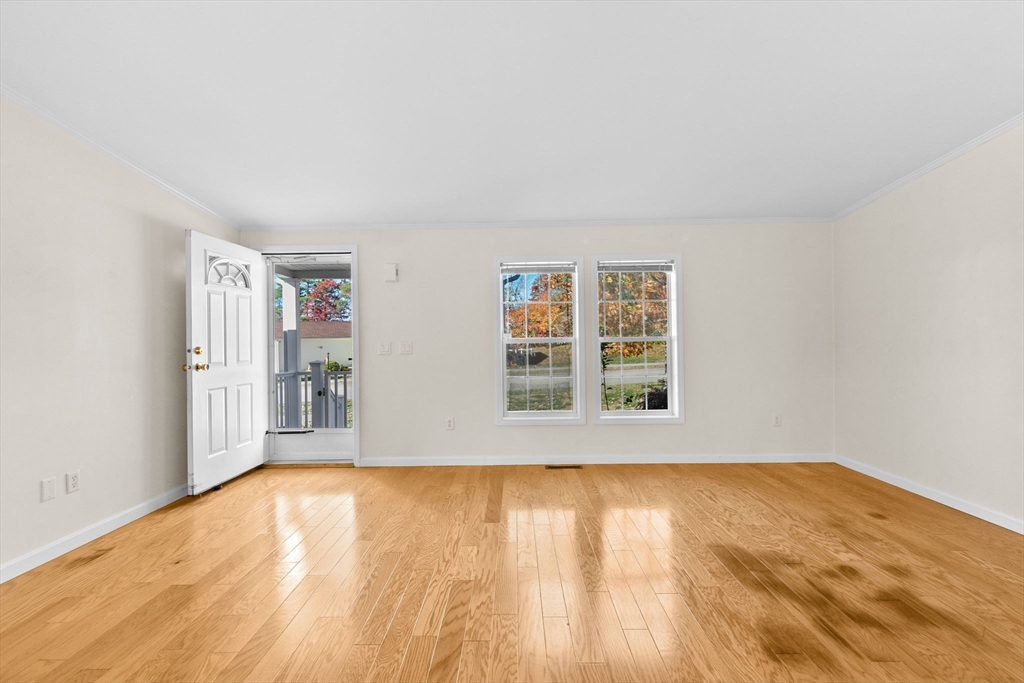 2602 Pheasant Lane Middleboro, MA 02346 - Photo 11 of 40 a view of empty room with wooden floor and fan