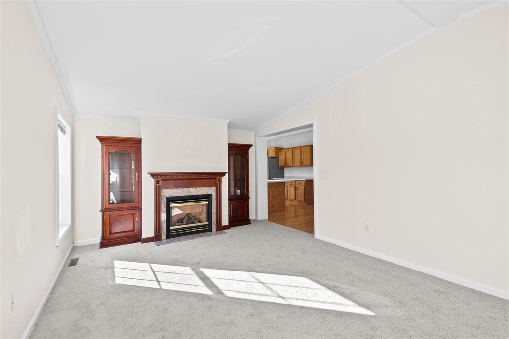 2602 Pheasant Lane Middleboro, MA 02346 - Photo 14 of 40 a view of an empty room with fire place