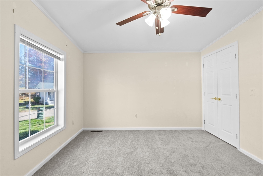 2602 Pheasant Lane Middleboro, MA 02346 - Photo 27 of 40 en empty room with windows and ceiling fan