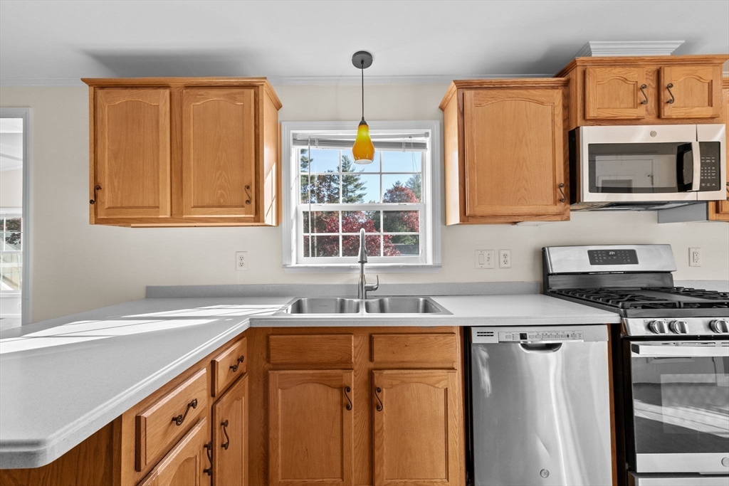 2602 Pheasant Lane Middleboro, MA 02346 - Photo 3 of 40 a kitchen with stainless steel appliances a sink stove and a window