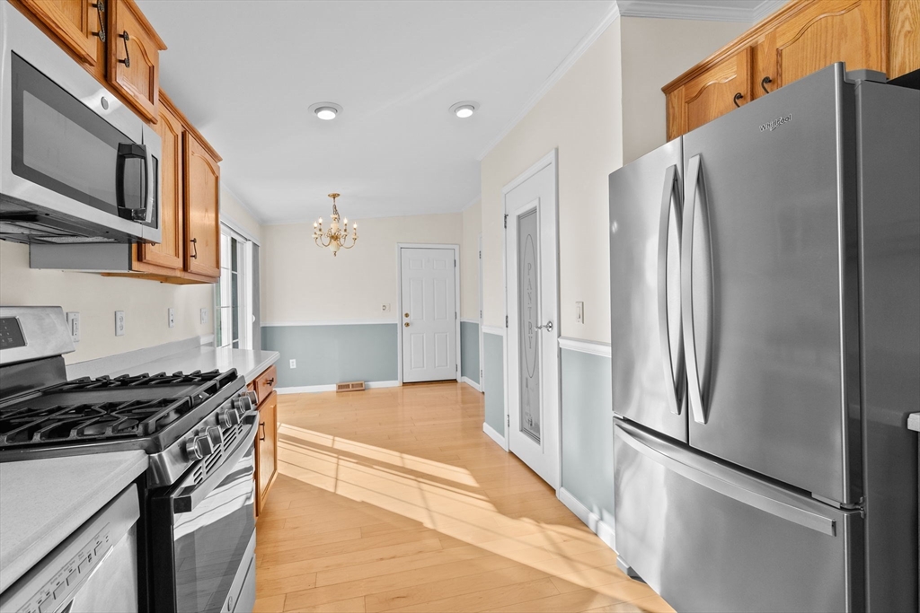 2602 Pheasant Lane Middleboro, MA 02346 - Photo 5 of 40 a kitchen with stainless steel appliances granite countertop a refrigerator and a stove