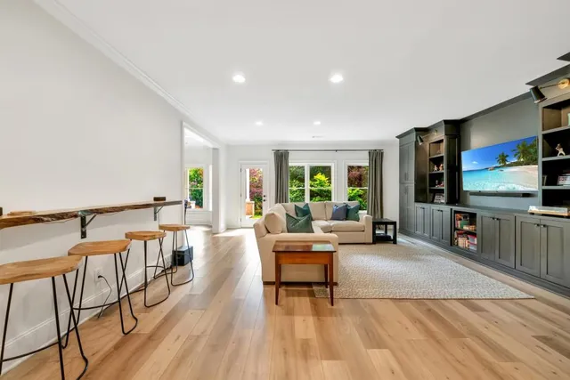 a kitchen with a sink dishwasher a stove a microwave and cabinets