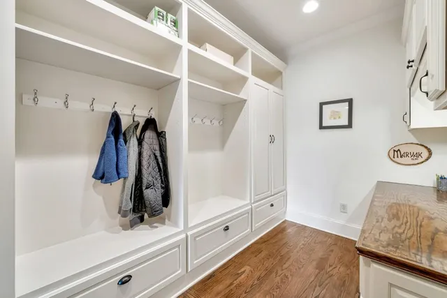 a bathroom with a sink a toilet and a large mirror