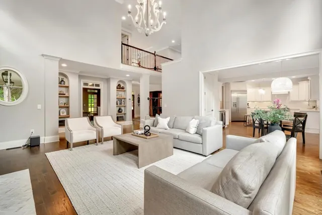 a living room with furniture a rug and a fireplace