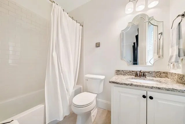 a view of a park with large trees