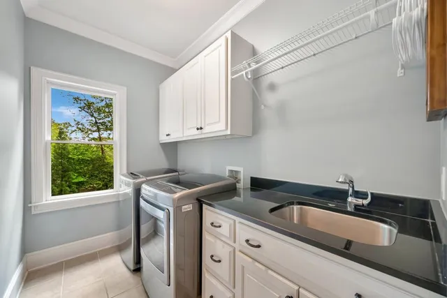 a view of a house with a yard and a garden