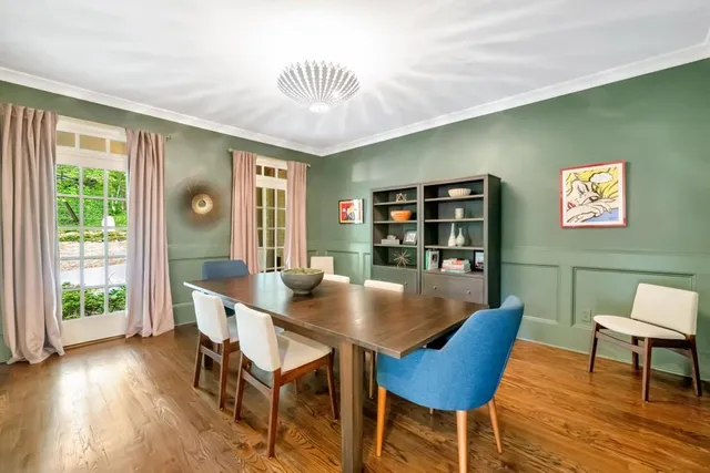 a view of empty room with furniture and wooden floor