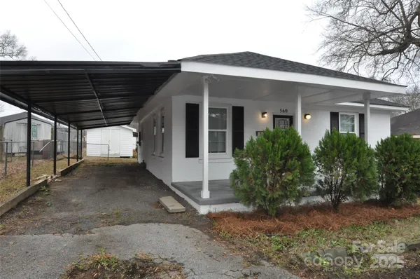 a view of a house with a dry back yard