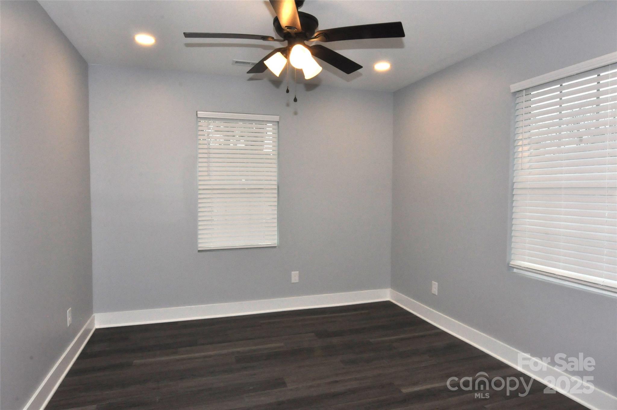 560 2nd Street, Unit 16 Chester, SC 29706 - Photo 14 of 25 a view of an empty room with wooden floor and a window