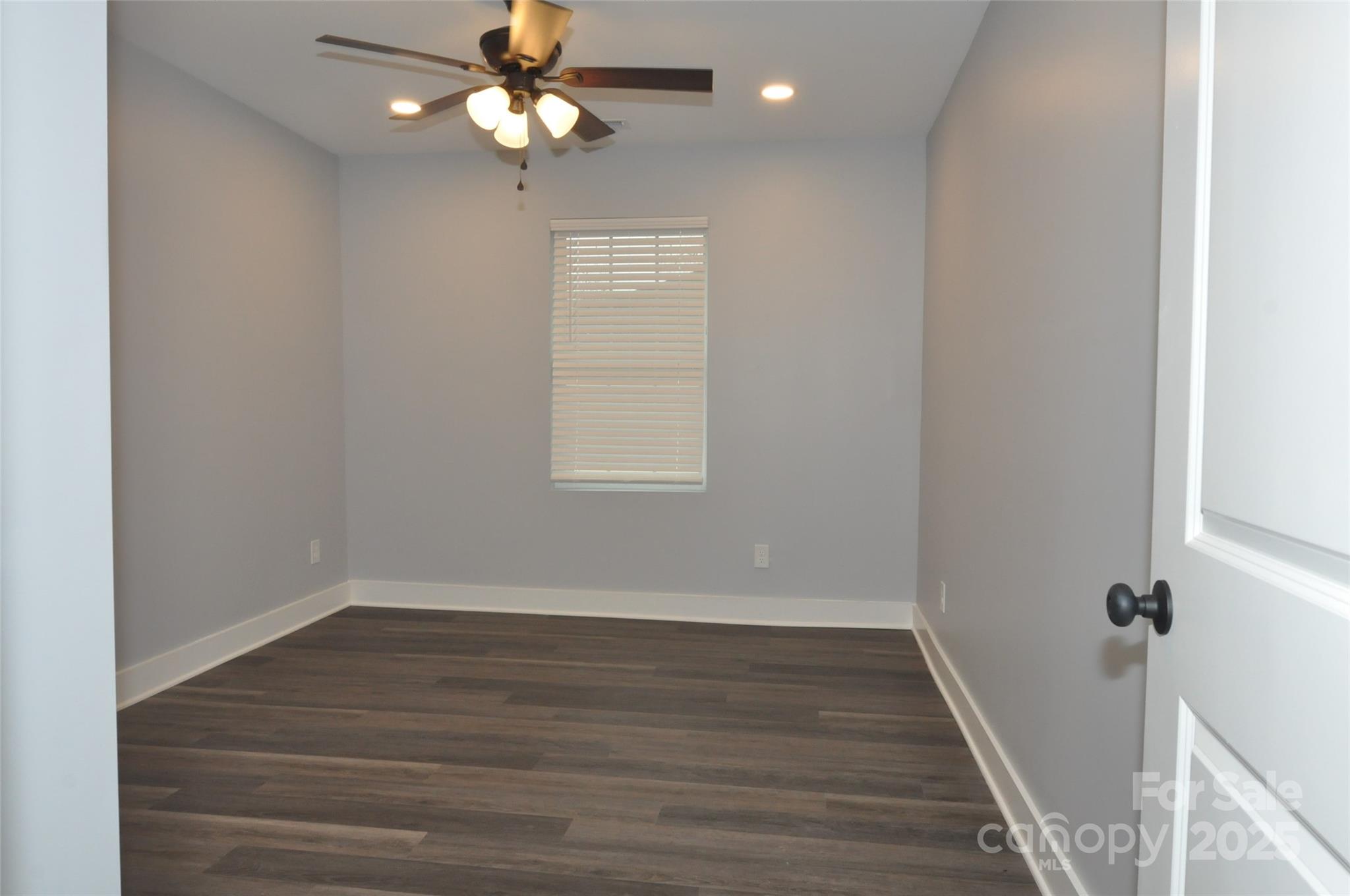 560 2nd Street, Unit 16 Chester, SC 29706 - Photo 16 of 25 wooden floor in an empty room with a window