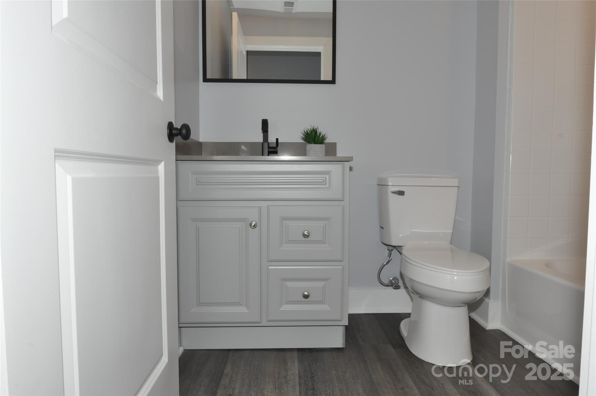 560 2nd Street, Unit 16 Chester, SC 29706 - Photo 19 of 25 a bathroom with a toilet sink and mirror