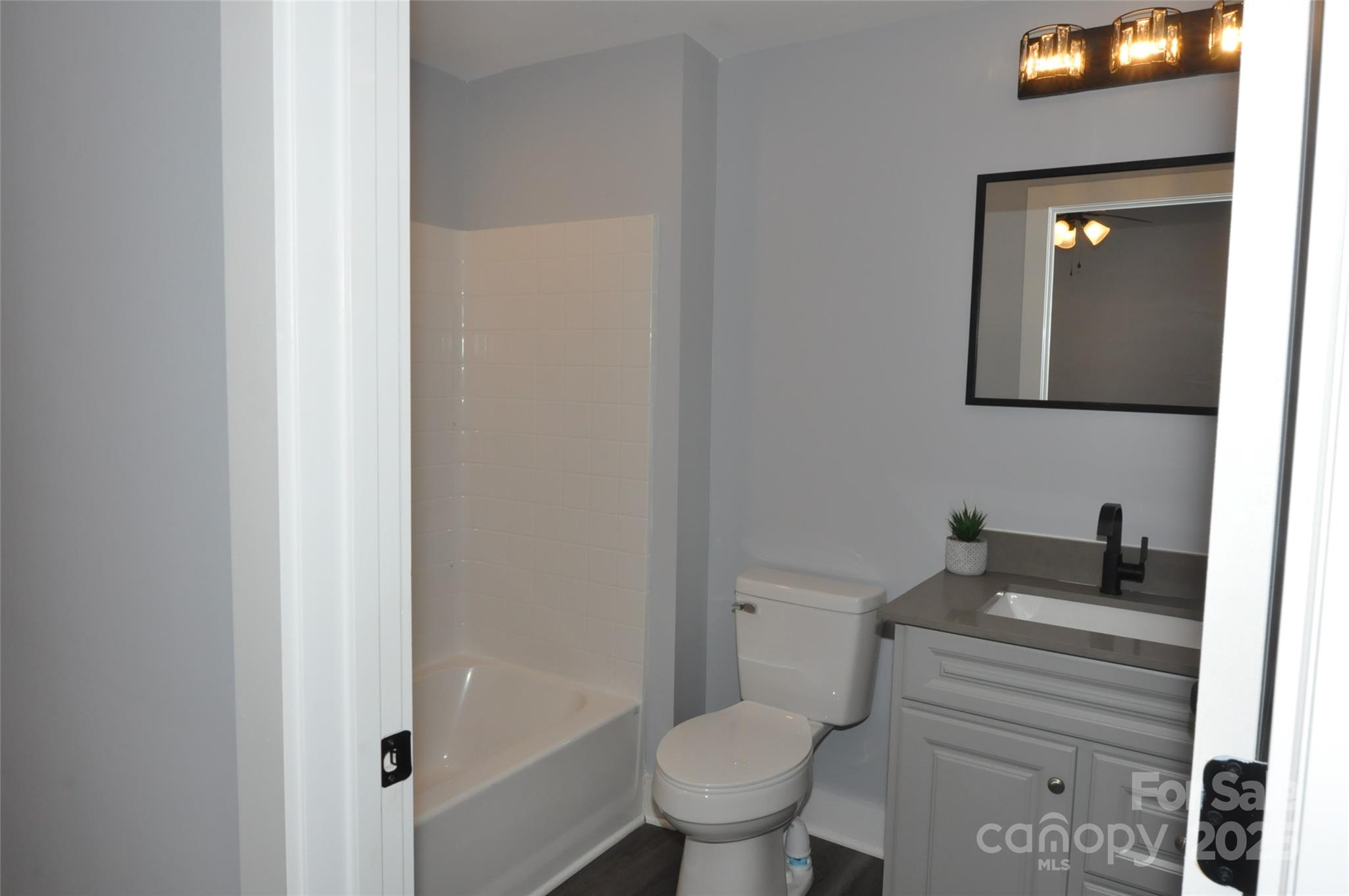 560 2nd Street, Unit 16 Chester, SC 29706 - Photo 22 of 25 a bathroom with a toilet sink and mirror