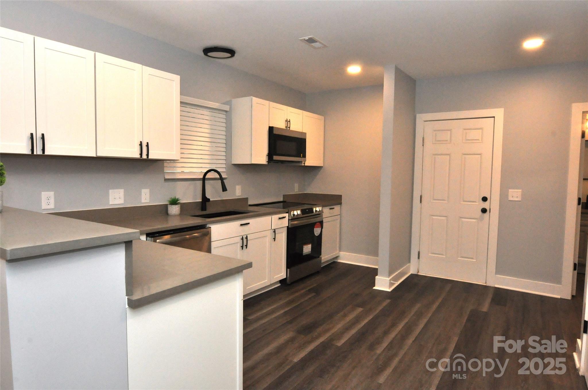 560 2nd Street, Unit 16 Chester, SC 29706 - Photo 6 of 25 a kitchen with a sink and a stove top oven