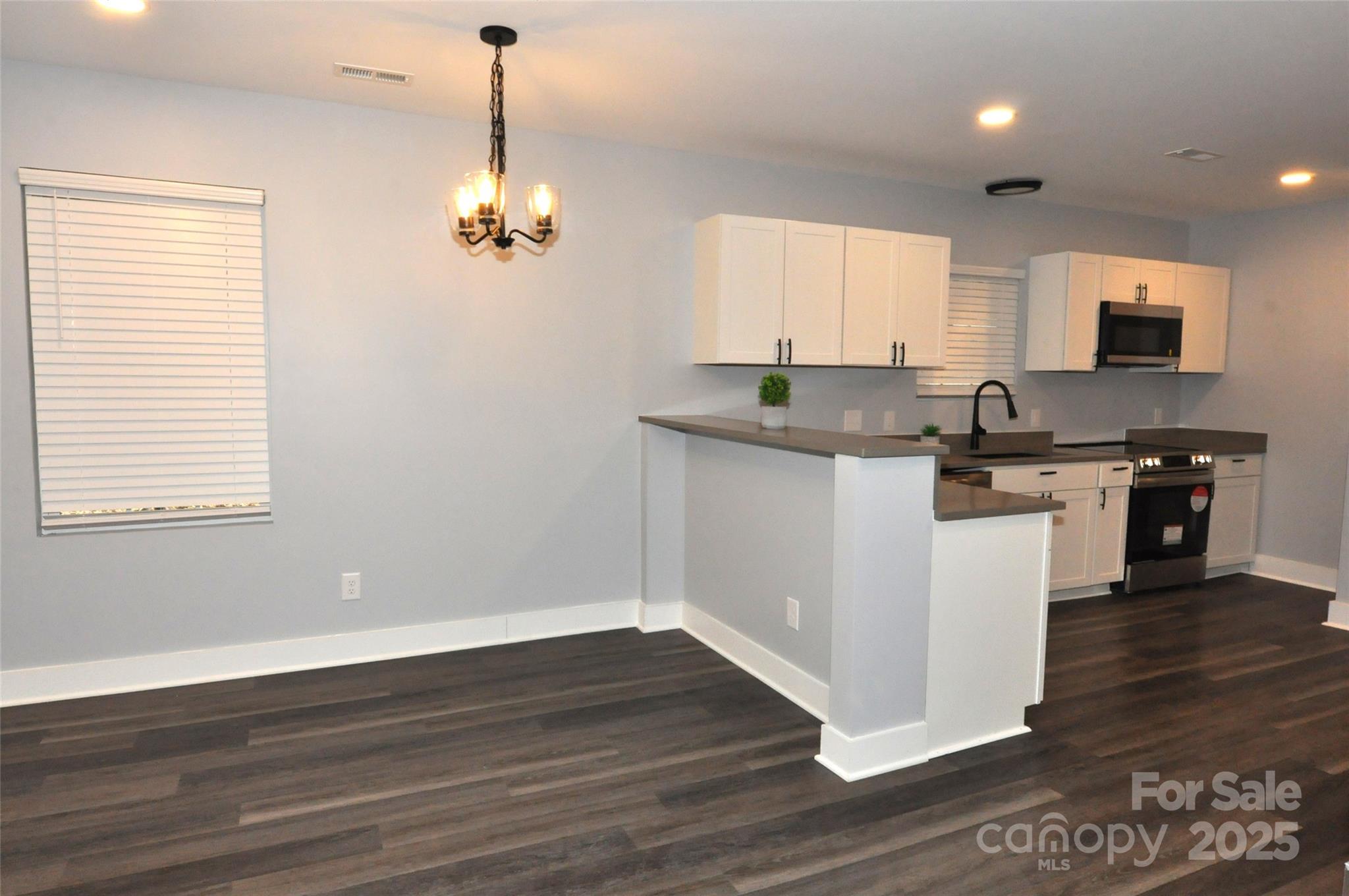 560 2nd Street, Unit 16 Chester, SC 29706 - Photo 9 of 25 a kitchen with a sink cabinets and wooden floor