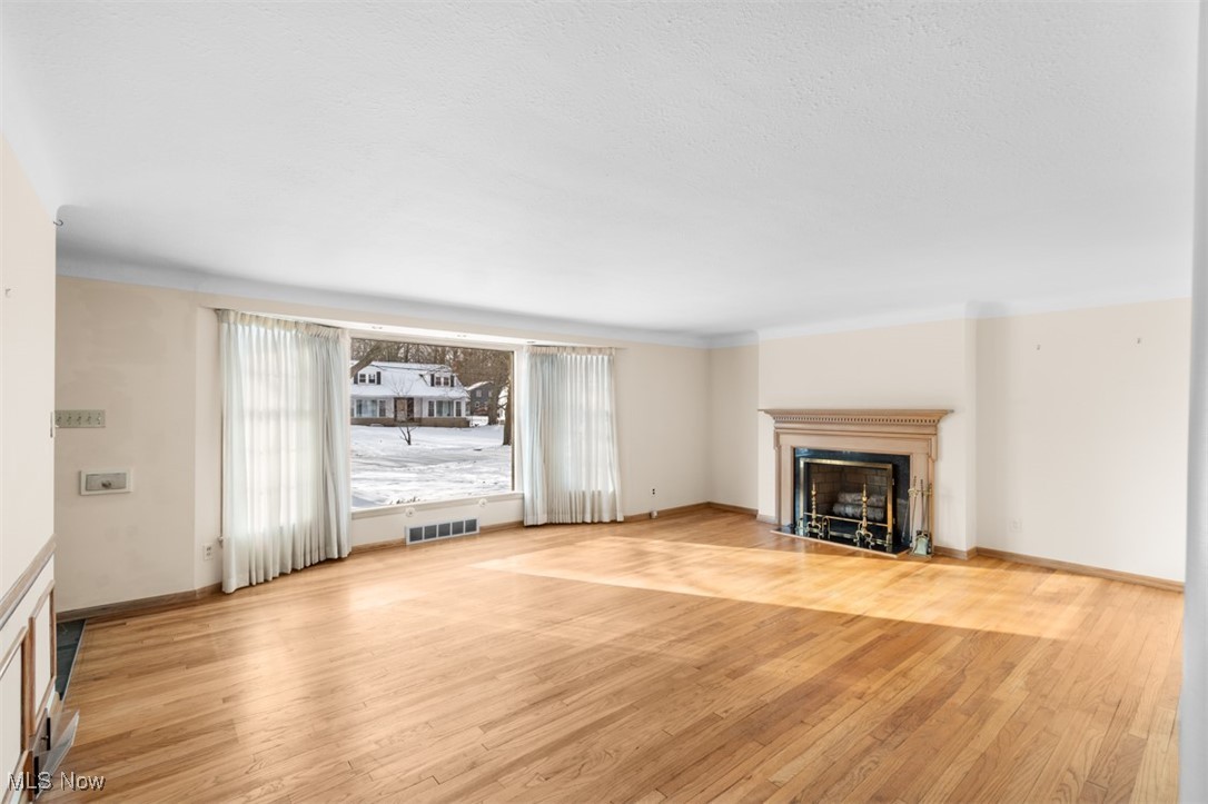 3609 Brinkmore Road Cleveland, OH 44121 - Photo 7 of 50 Unfurnished living room featuring light hardwood flooring