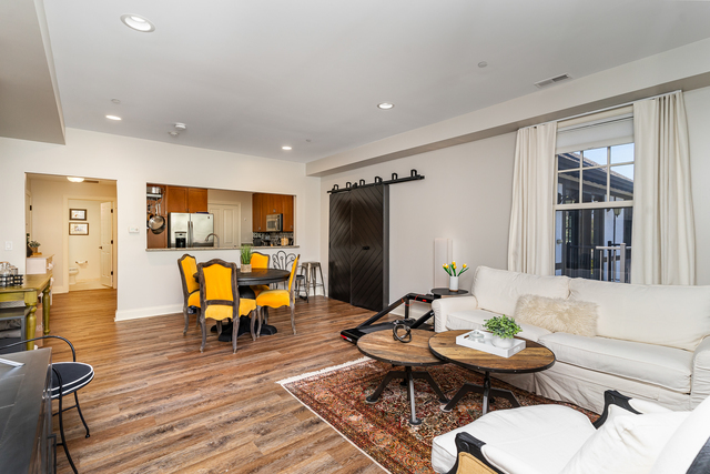 720 Green Bay Road, Unit 2E Winnetka, IL 60093 - Photo 4 of 15 a living room with furniture kitchen view and a large window