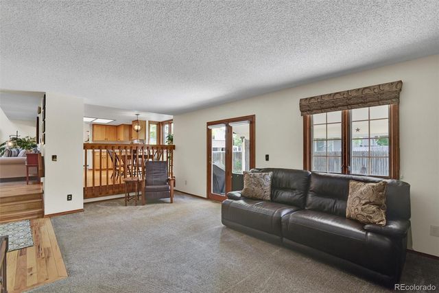 a living room with a couch and a window