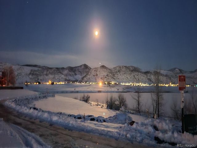 a bathroom with a sink and view of living room