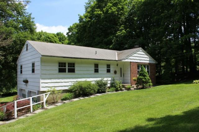 18 Ridgebury Road Ridgefield, CT 06877 - Photo 1 of 1 a view of a house with a yard and sitting area