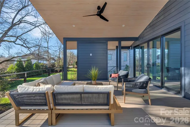 a outdoor space with patio the couches and a dining table and chairs with the couches chairs