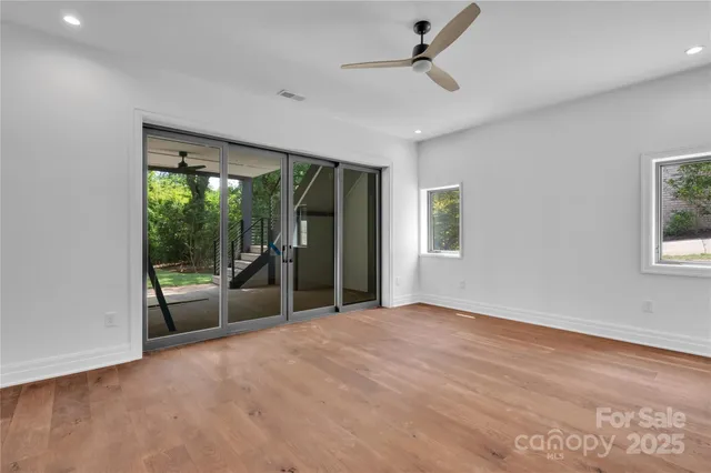 a view of empty room with floor to ceiling window