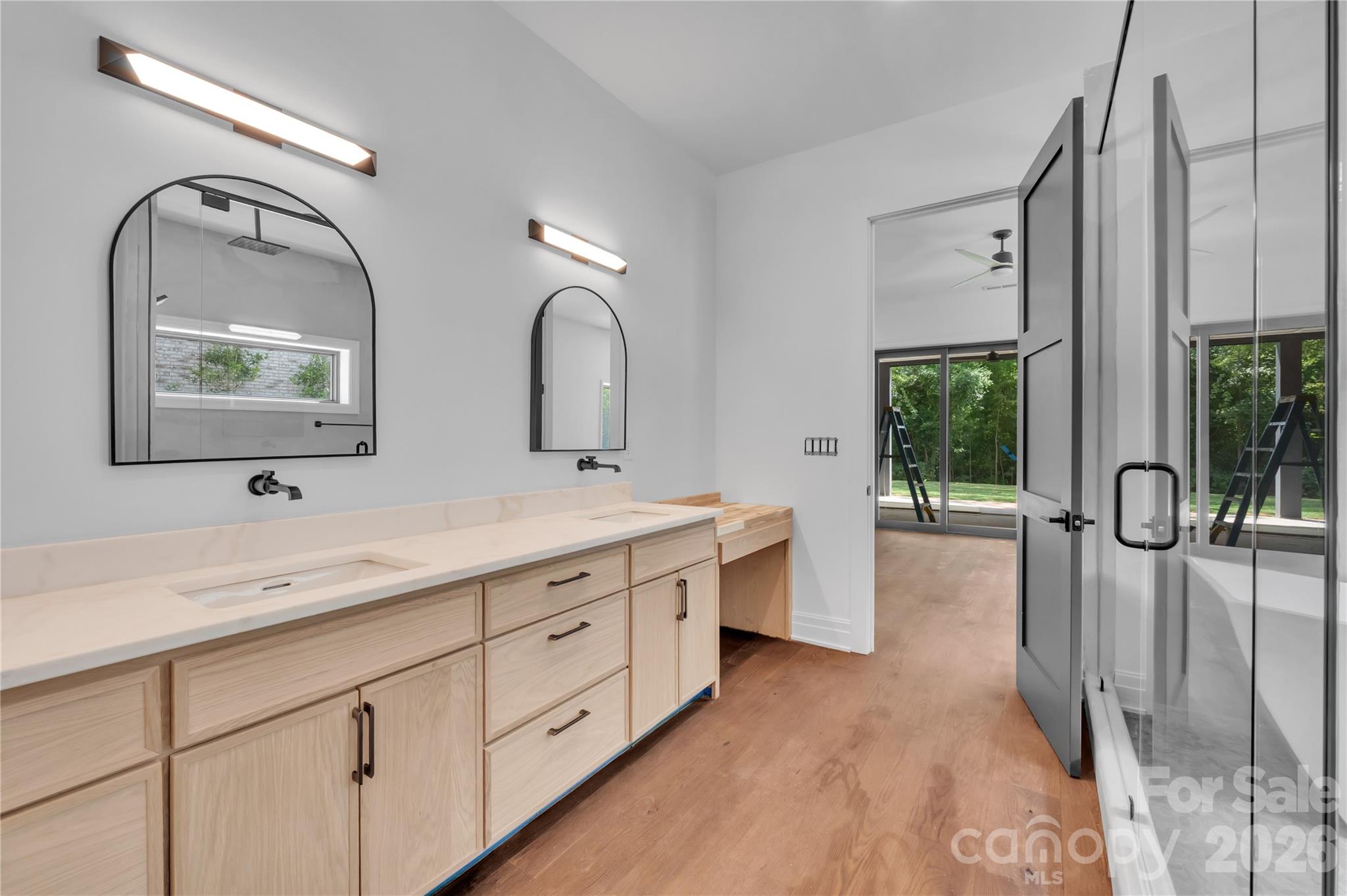 1423 South Wendover Road Charlotte, NC 28211 - Photo 29 of 31 a spacious bathroom with a double vanity sink and mirror