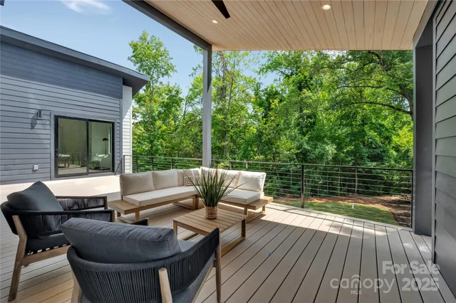 a view of balcony with couch and wooden floor