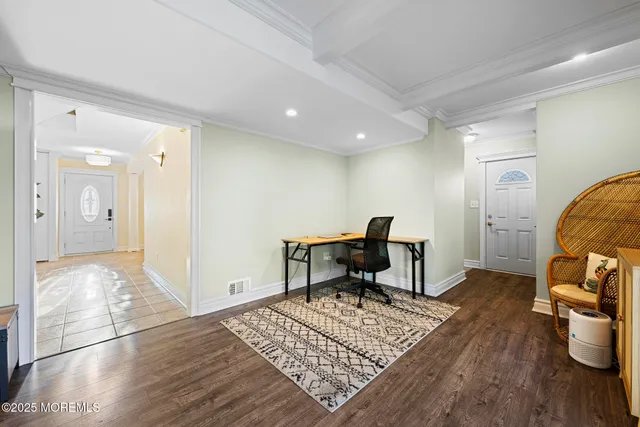 a view of a livingroom with furniture and wooden floor