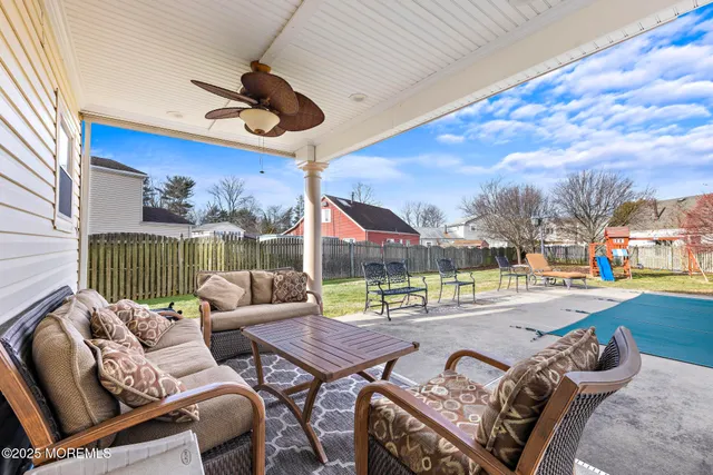 a outdoor space with patio the couches and a potted plant
