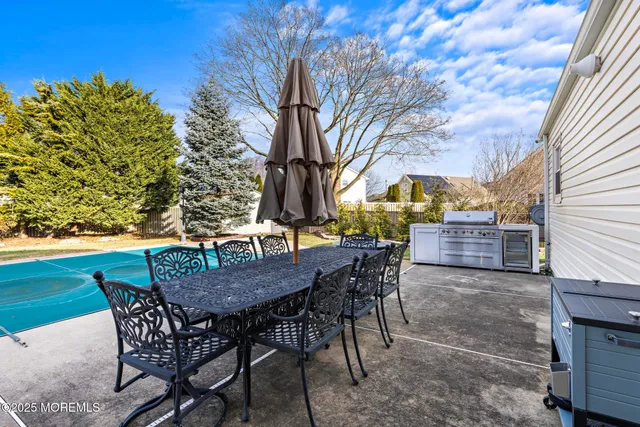 a view of a chairs and table in the patio