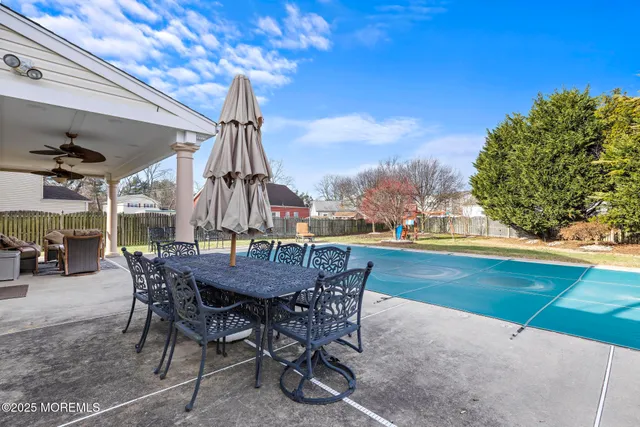 a view of an outside dining space with furniture