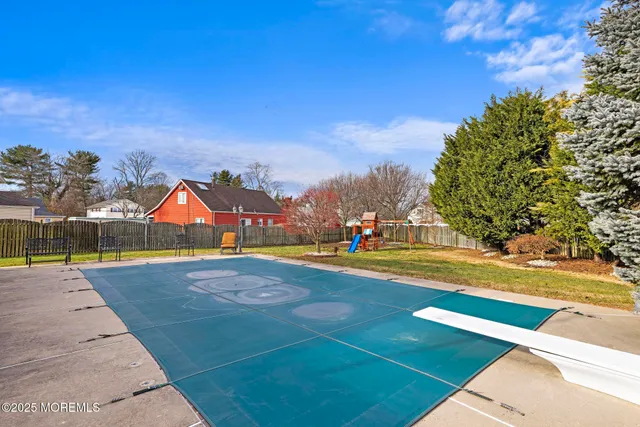 a view of an outdoor space and basketball court