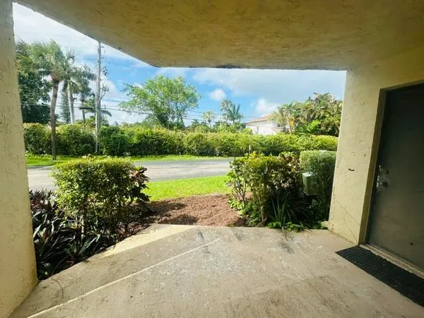 a view of a garden with an outdoor space