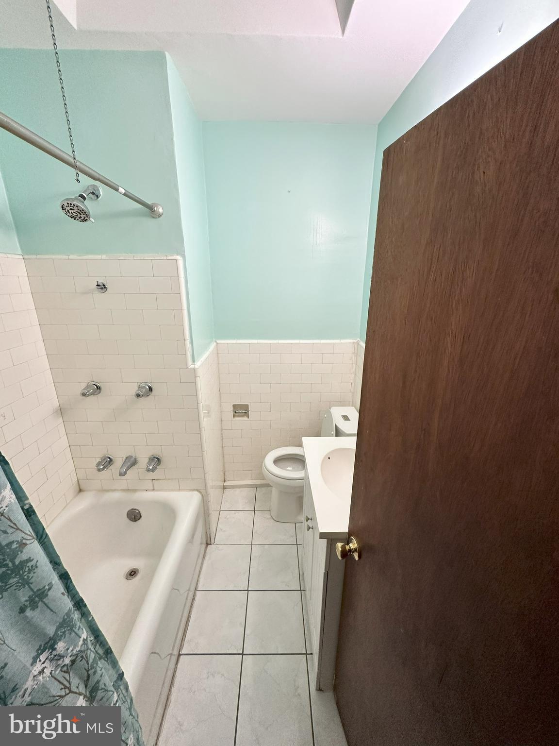 1126 Sanger Street Philadelphia, PA 19124 - Photo 18 of 21 a bathroom with a bathtub shower and toilet