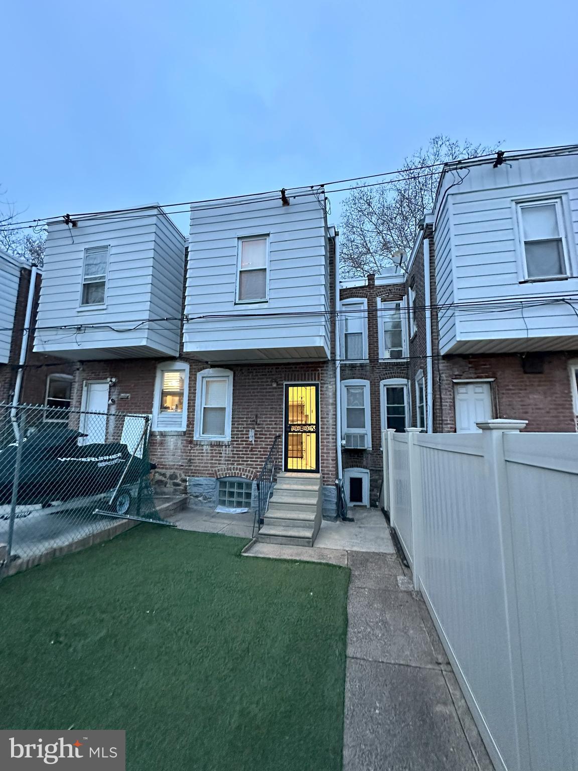 1126 Sanger Street Philadelphia, PA 19124 - Photo 20 of 21 a front view of a house with a yard