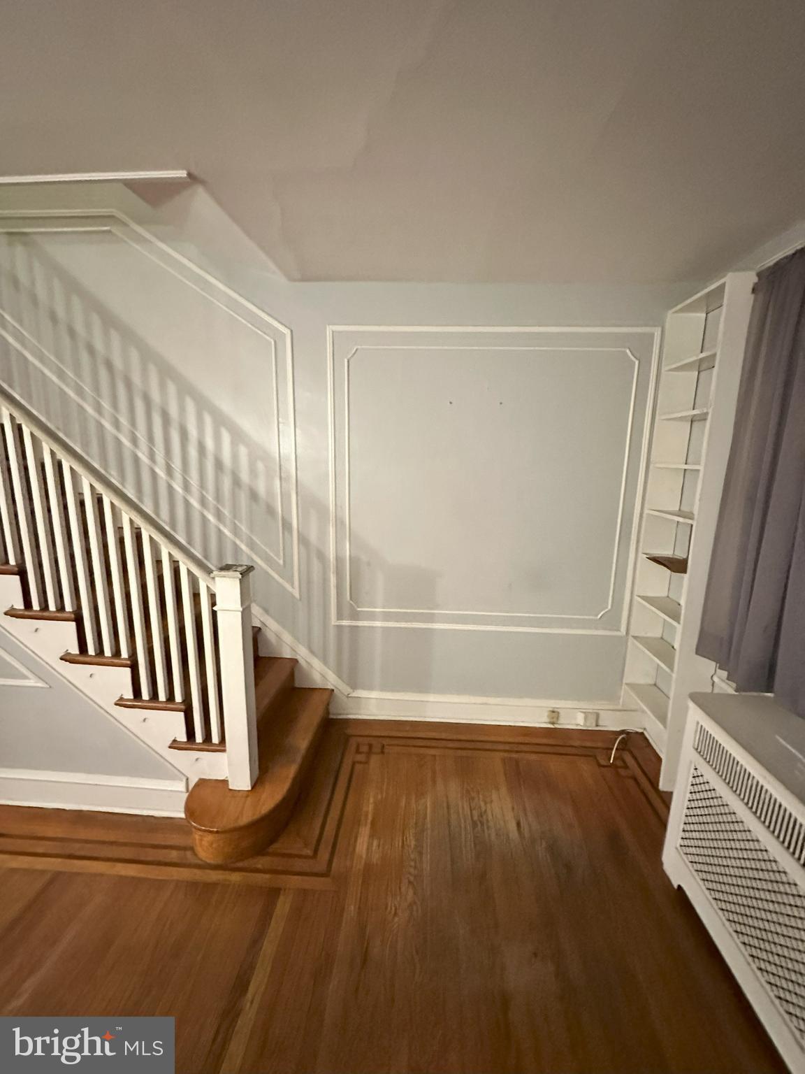 1126 Sanger Street Philadelphia, PA 19124 - Photo 10 of 21 a view of a room with wooden floor and staircase