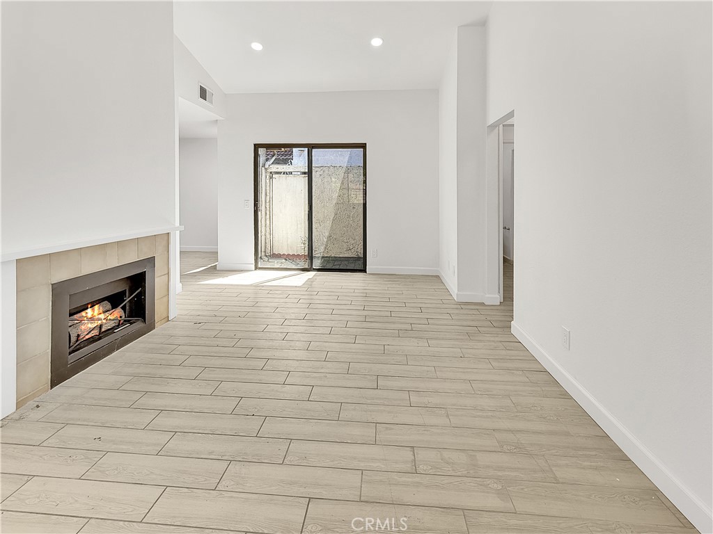 11127 Delaware Street Rancho Cucamonga, CA 91701 - Photo 8 of 18 a view of an empty room and fire place
