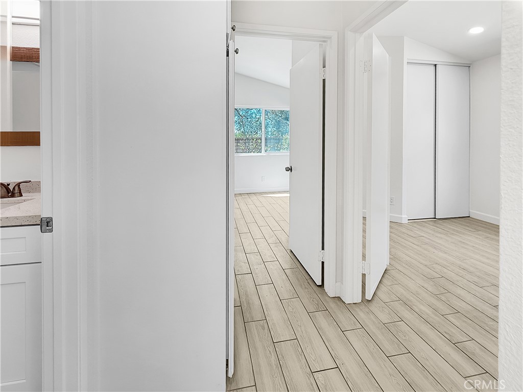 11127 Delaware Street Rancho Cucamonga, CA 91701 - Photo 9 of 18 a view of a hallway with wooden floor