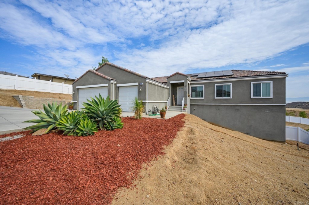 13178 Via Sherry Riverside, CA 92503 - Photo 1 of 1 a front view of a house with a yard and garage