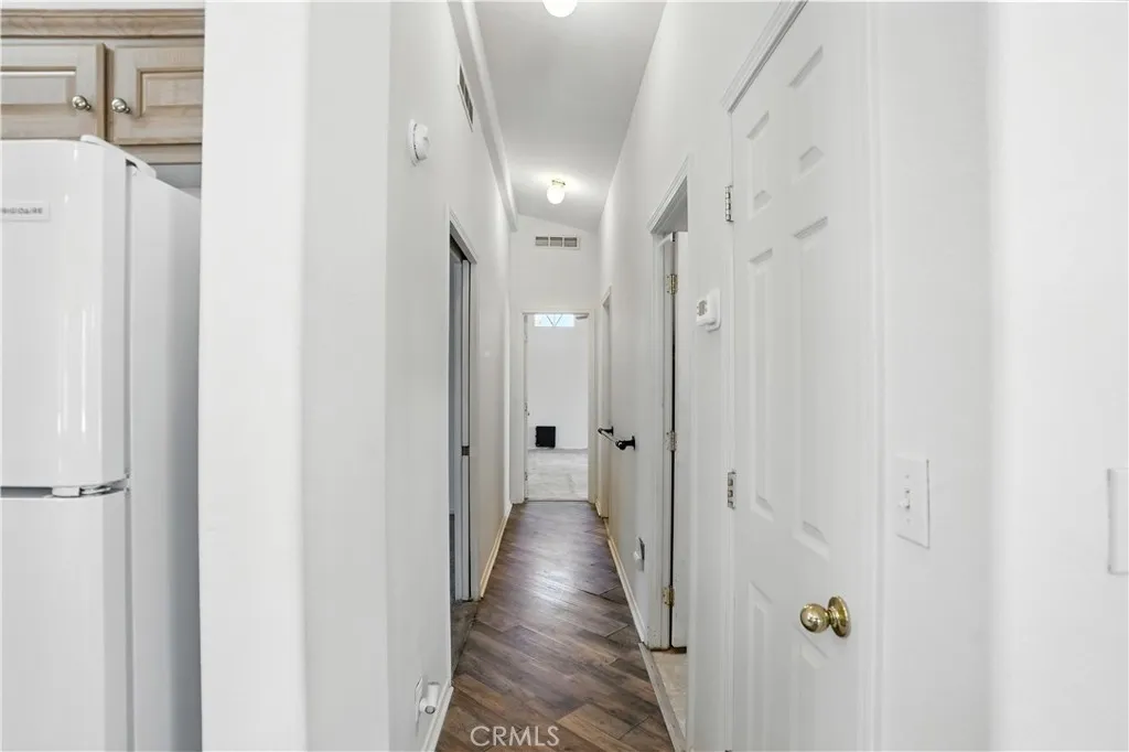 27250 Murrieta Road, Unit 216 Menifee, CA 92586 - Photo 13 of 58 a view of a hallway with wooden floor