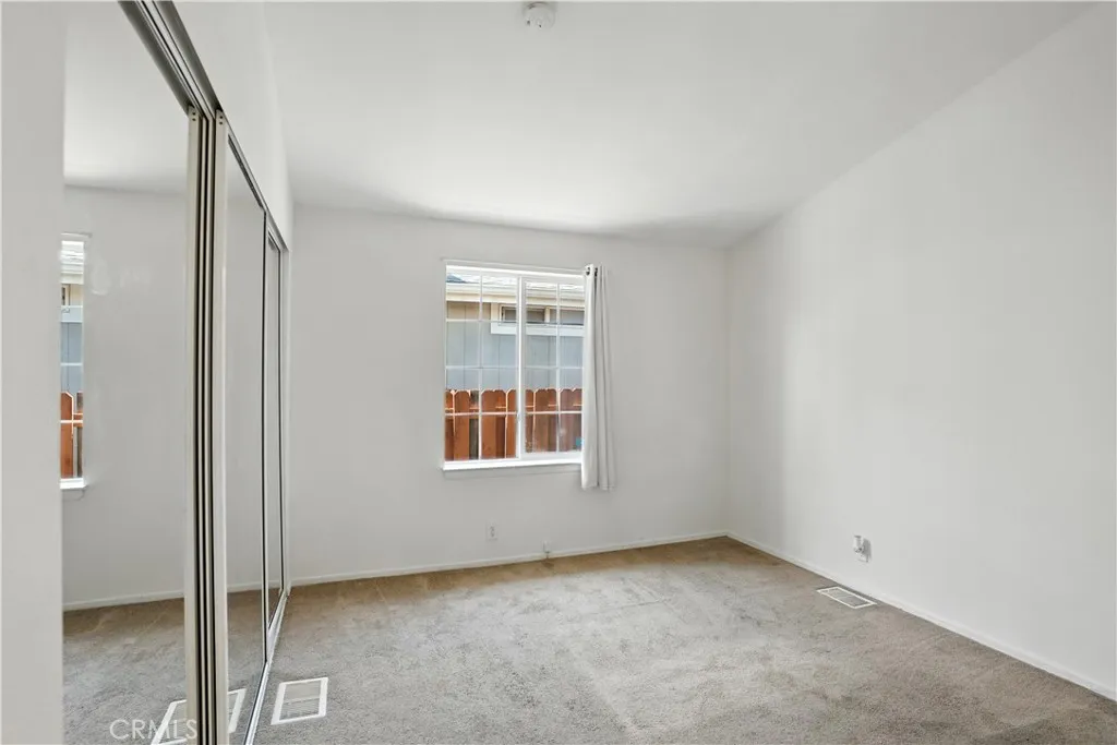 27250 Murrieta Road, Unit 216 Menifee, CA 92586 - Photo 18 of 58 an empty room with windows