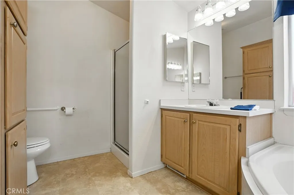 27250 Murrieta Road, Unit 216 Menifee, CA 92586 - Photo 26 of 58 a bathroom with a double vanity sink mirror and toilet