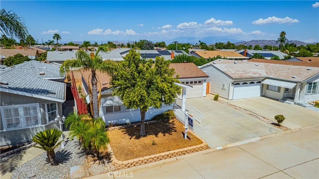 27250 Murrieta Road, Unit 216 Menifee, CA 92586 - Photo 34 of 58 an aerial view of residential houses with outdoor space and seating area
