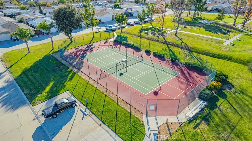 27250 Murrieta Road, Unit 216 Menifee, CA 92586 - Photo 44 of 58 an aerial view of a swimming pool with a yard and lake view